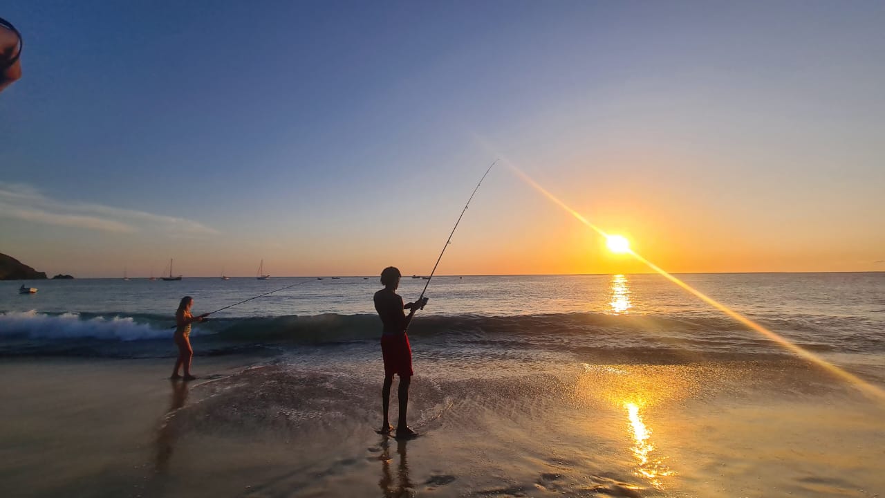 Group fishing with fishing rod on Mindelo beach